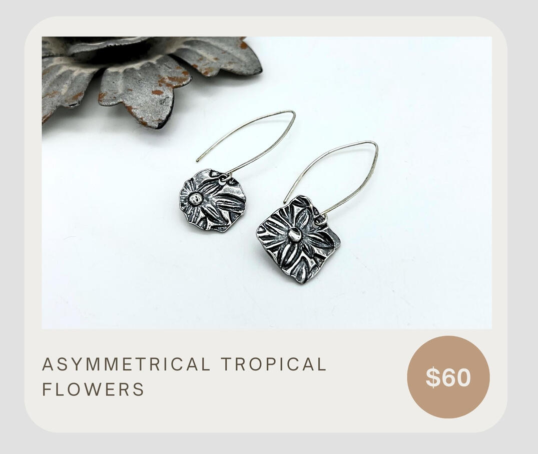 Beautiful Asymmetrical tropical flower dangles. Layered .999 with a textured back and .925 ear wires. These are the perfect earrings to turn heads. Dress them up or wear them casually.