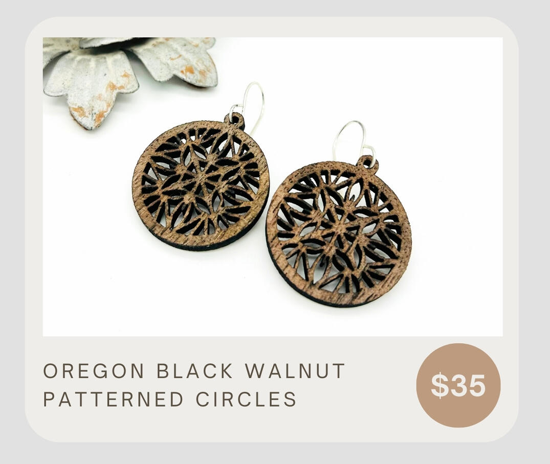 Gorgeous Oregon Black Walnut lightweight patterned dangle earrings. The perfect way to add a bit of warmth to your outfit. These circles are about 1 1/4&quot; wide.