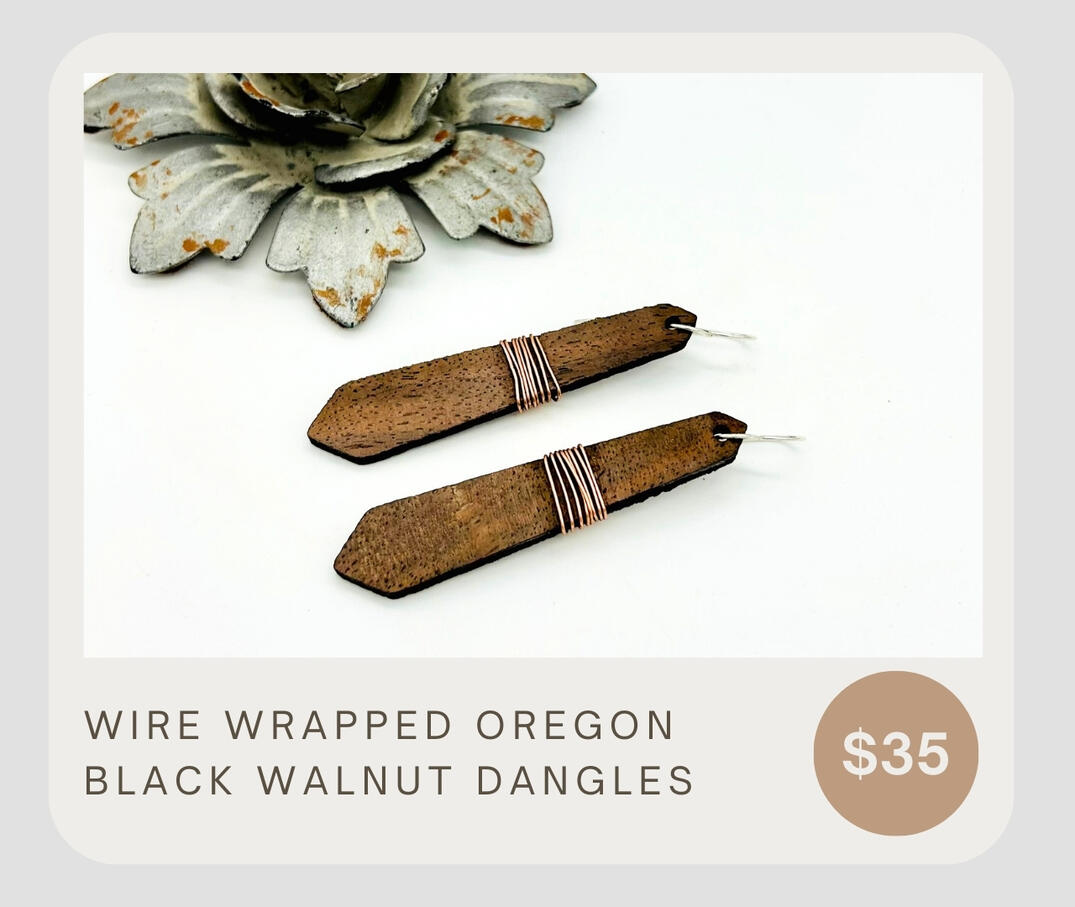 Dangling Oregon Black Walnut earrings with copper wire wrapping. Simple, yet sophisticated, and lightweight. Style with any casual outfit to add some Pacific Northwest flare.