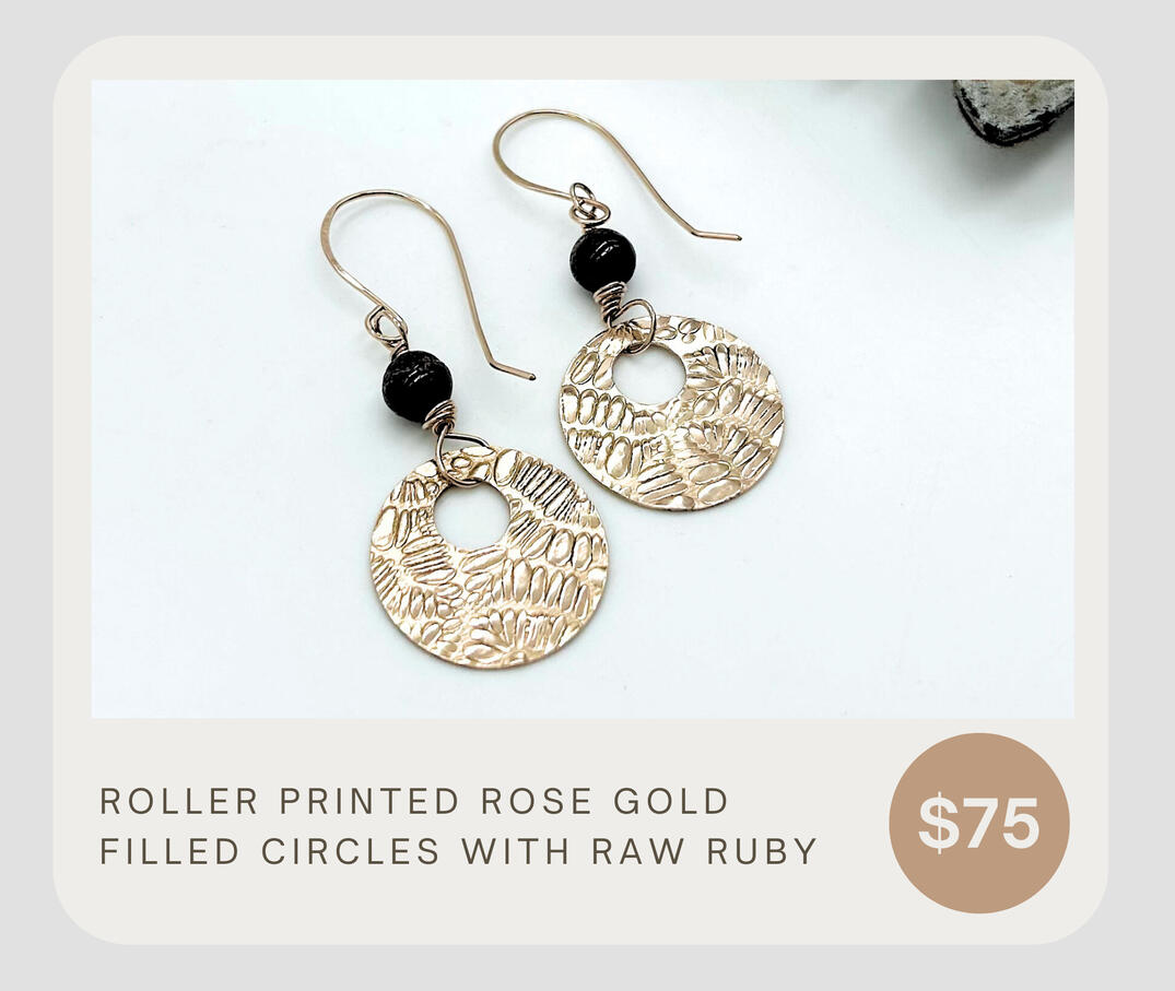 These earrings are rose gold filled and roller printed for a deep, luxurious, funky fun pattern. The earrings are adorned with raw ruby gemstones. They are lightweight and can be worn casually or dressed up. The perfect gift!