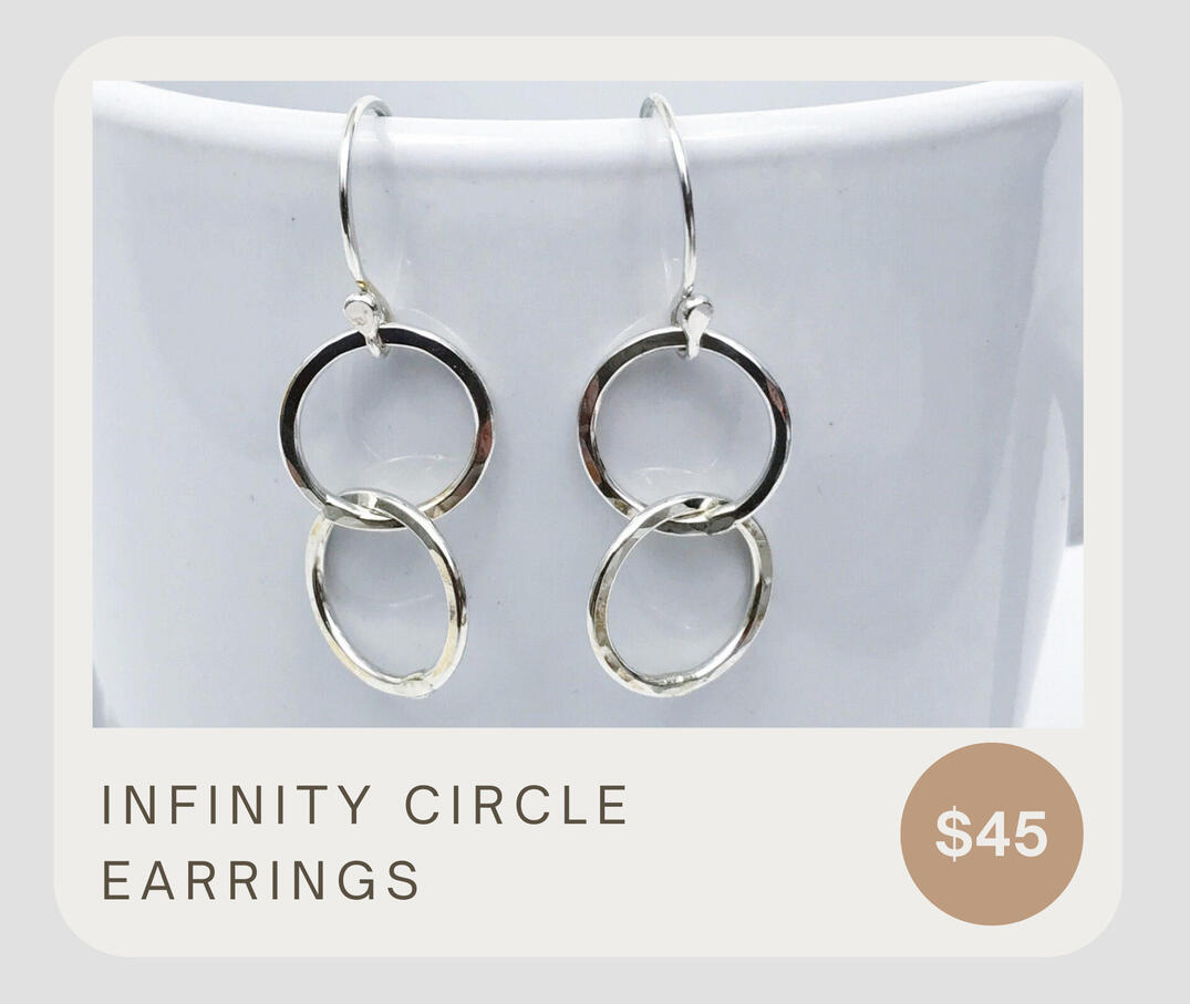 A classic and simple look. .925 sterling silver hammered connected circles as well as handcrafted sterling silver ear wires. These circle earrings dangle about 1 3/8 inches and the circles are about 1/2 inch wide.