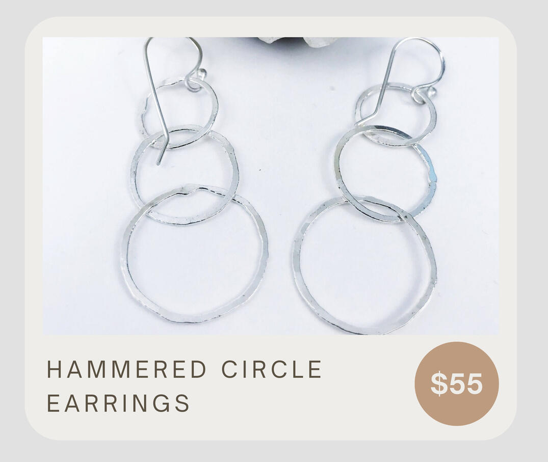 These hammered sterling silver circle earrings combine .999 fine silver and .925 sterling silver for a beautiful lightweight geometric presence. These earrings dangle about 2 1/4 inches from top to bottom.