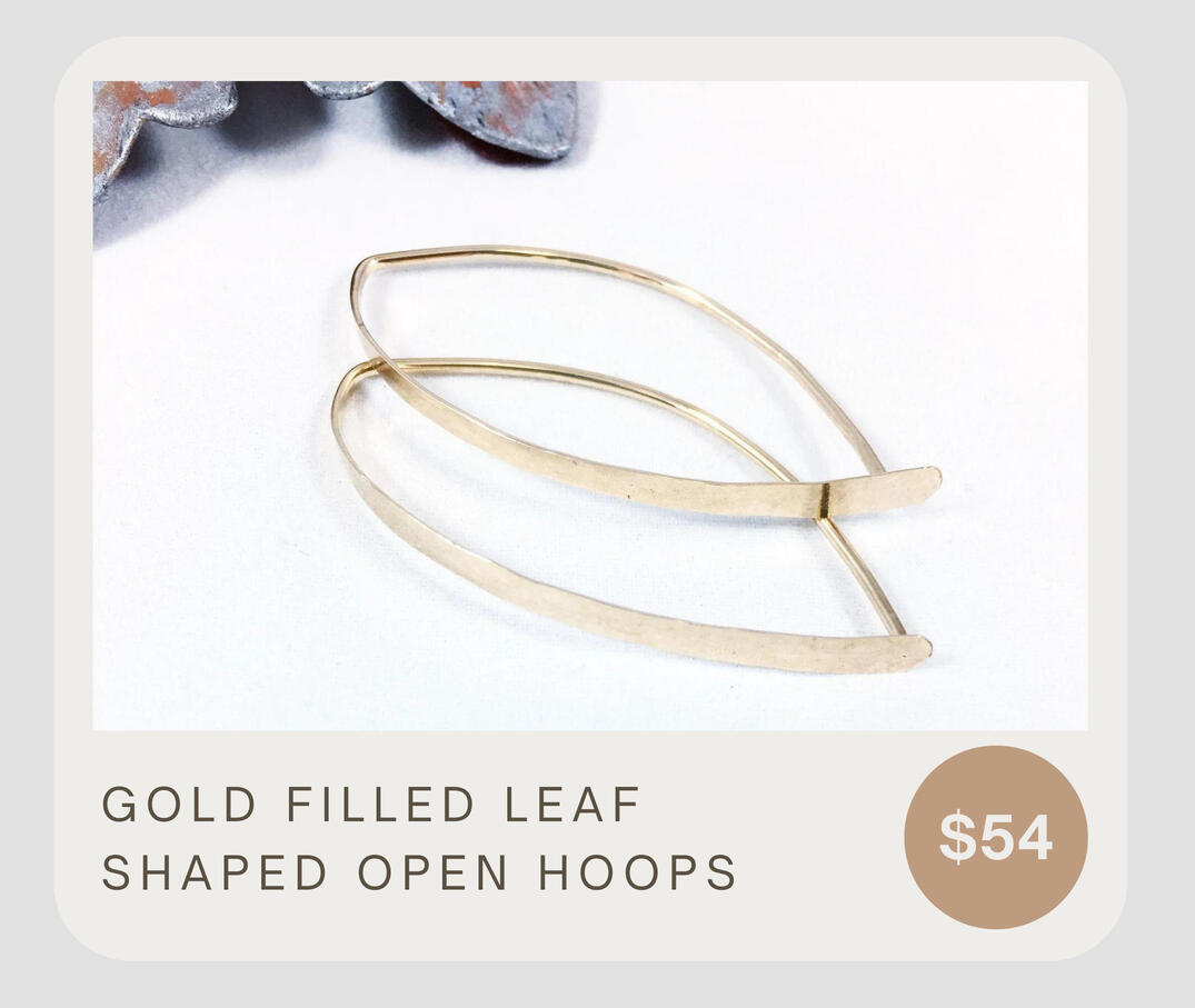 Beautiful light weight 14k gold filled open hoop earrings. These leaf shaped earrings have a hammered finish in the front, with a smooth ear wire back. Great movement - great sheen! Earring length measures approximately 1 5/8” long and 3/4” wide.