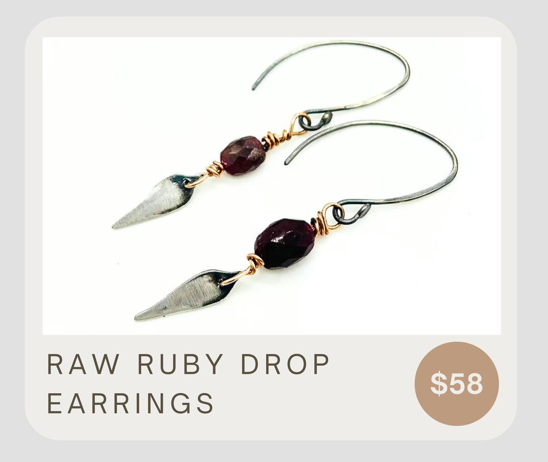Designed with rough cut faceted Ruby gemstones, these distinctive earrings boast fine silver dangles and a copper wrap with sterling silver ear wires.