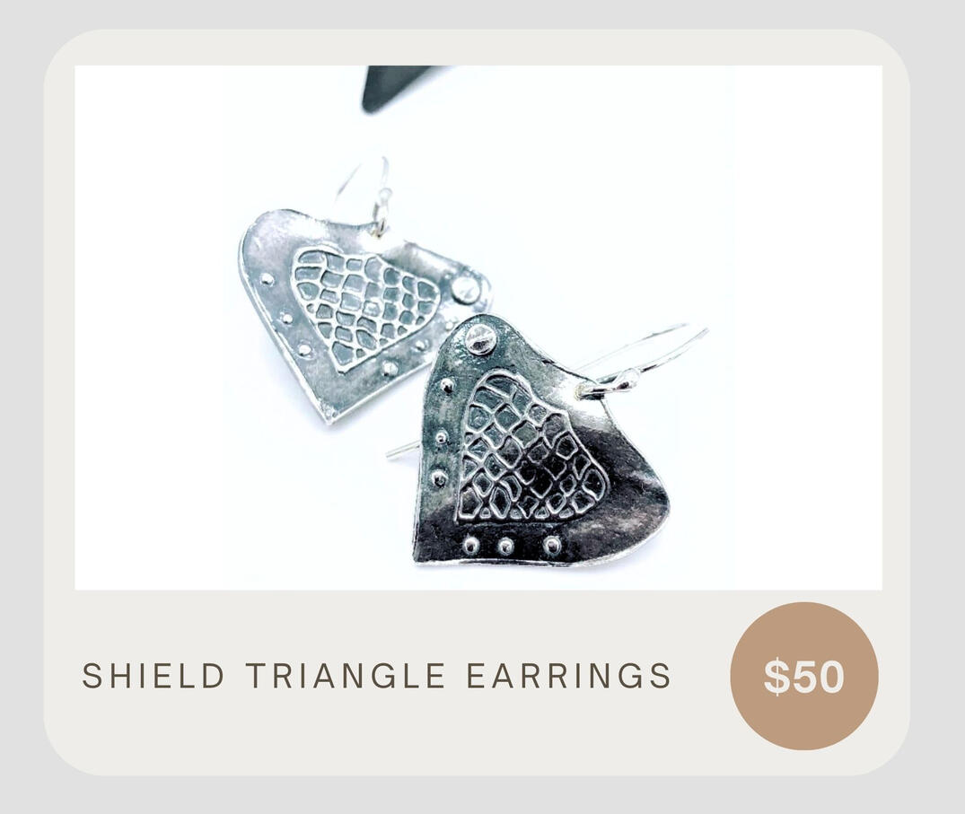 Unique and lightweight earrings made from sterling silver featuring a handcrafted pattern and sterling silver ear wires.