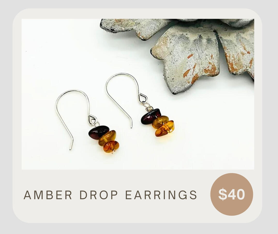 Amber Drop Earrings feature three beautiful amber gemstones set in sterling silver ear wires, for a stunning addition to any outfit. Crafted with high quality materials, these earrings offer a timeless shine and elegant style.