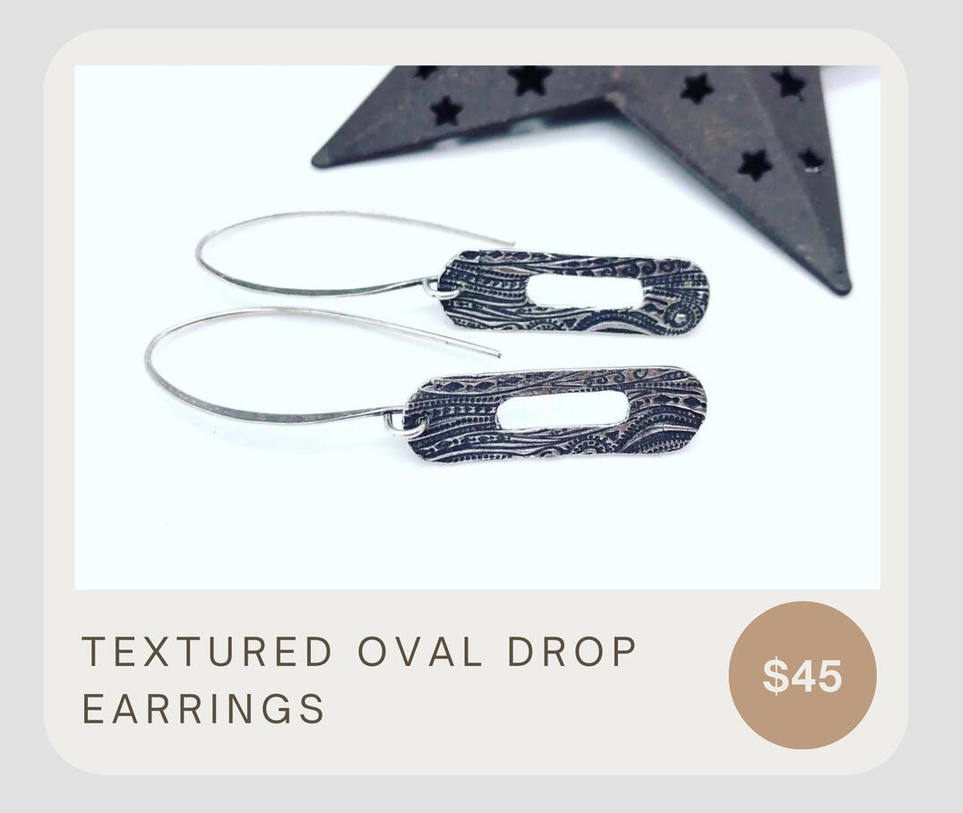 Unique &amp; simple! These stunning earrings feature a textured oval in a drop style earring. Made from sterling silver.