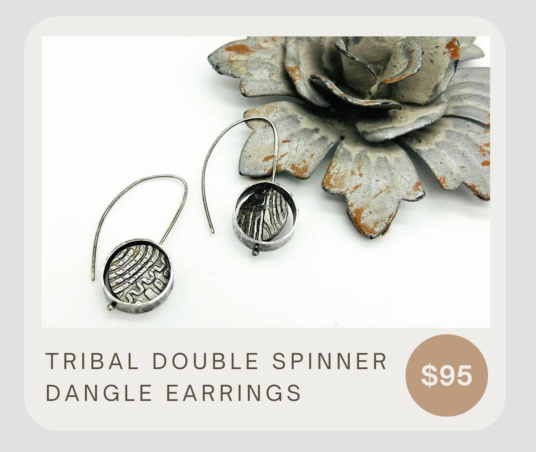 The Twisted Designs Tribal Double Spinner Dangle Earrings are made with fine silver and sterling silver ear wires. These unique earrings feature a tribal print design with a fidget spinner dangle.