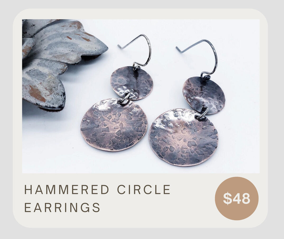 These tribal copper disc earrings hang from handmade 925 sterling silver ear wires. Eye-catching textures on each disc are sure to make you feel adventurous! These dangle about 2 inches from top to bottom &amp; the discs are about 5/8 &amp; 7/8 inches in diameter.