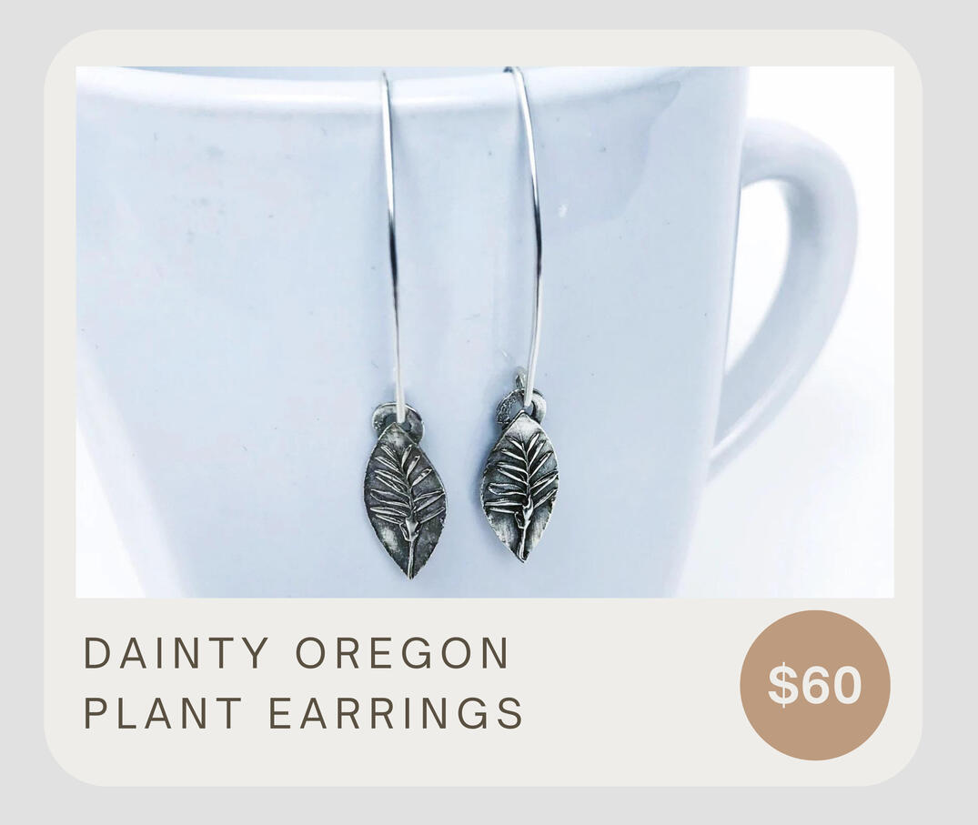 These lightweight artisan leaf earrings were made from beautiful dainty plants found in Oregon. About 2 inches from top of ear wire to bottom of earring. The leaves are about 6/8 inch by 3/8 inch oval dangles.