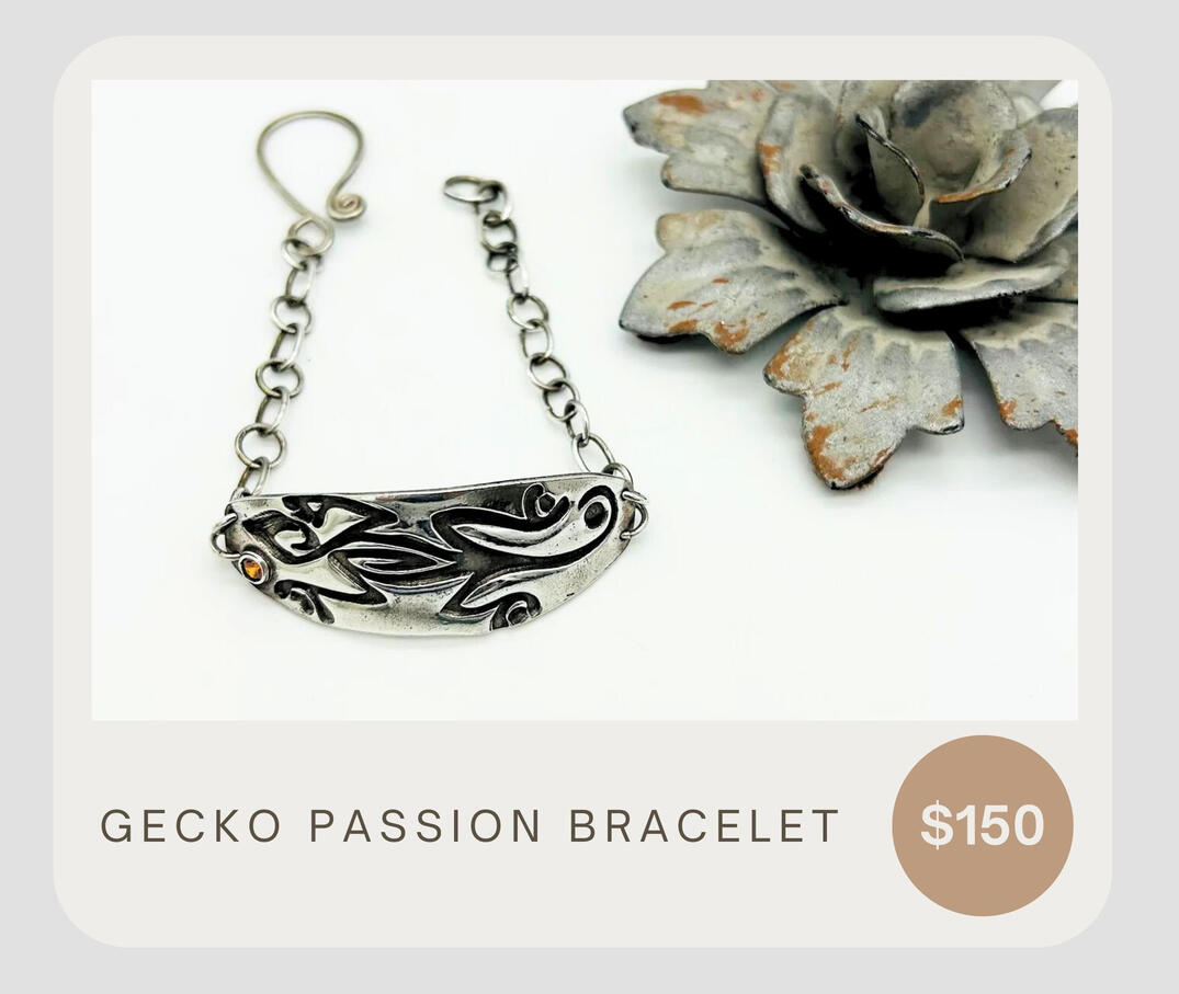 Gecko Passion Bracelet features a handmade sterling silver chain and clasp, a detailed gecko impression, and an orange cubic zirconium stone.