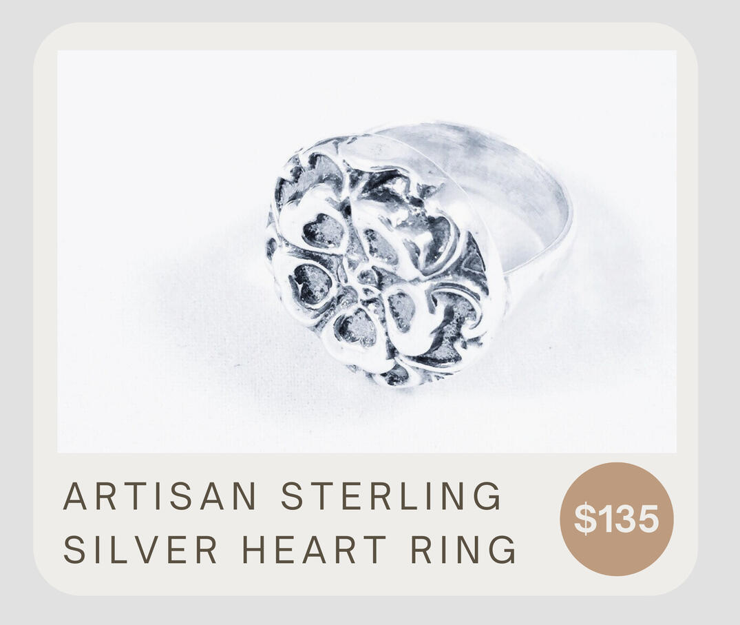 Bold and beautiful - this sterling silver flat top ring features a 3 dimensional circle of hearts. The band has an attractive hammered finish The design was created from an antique button. The ring top measures approximately 3/4” in diameter.