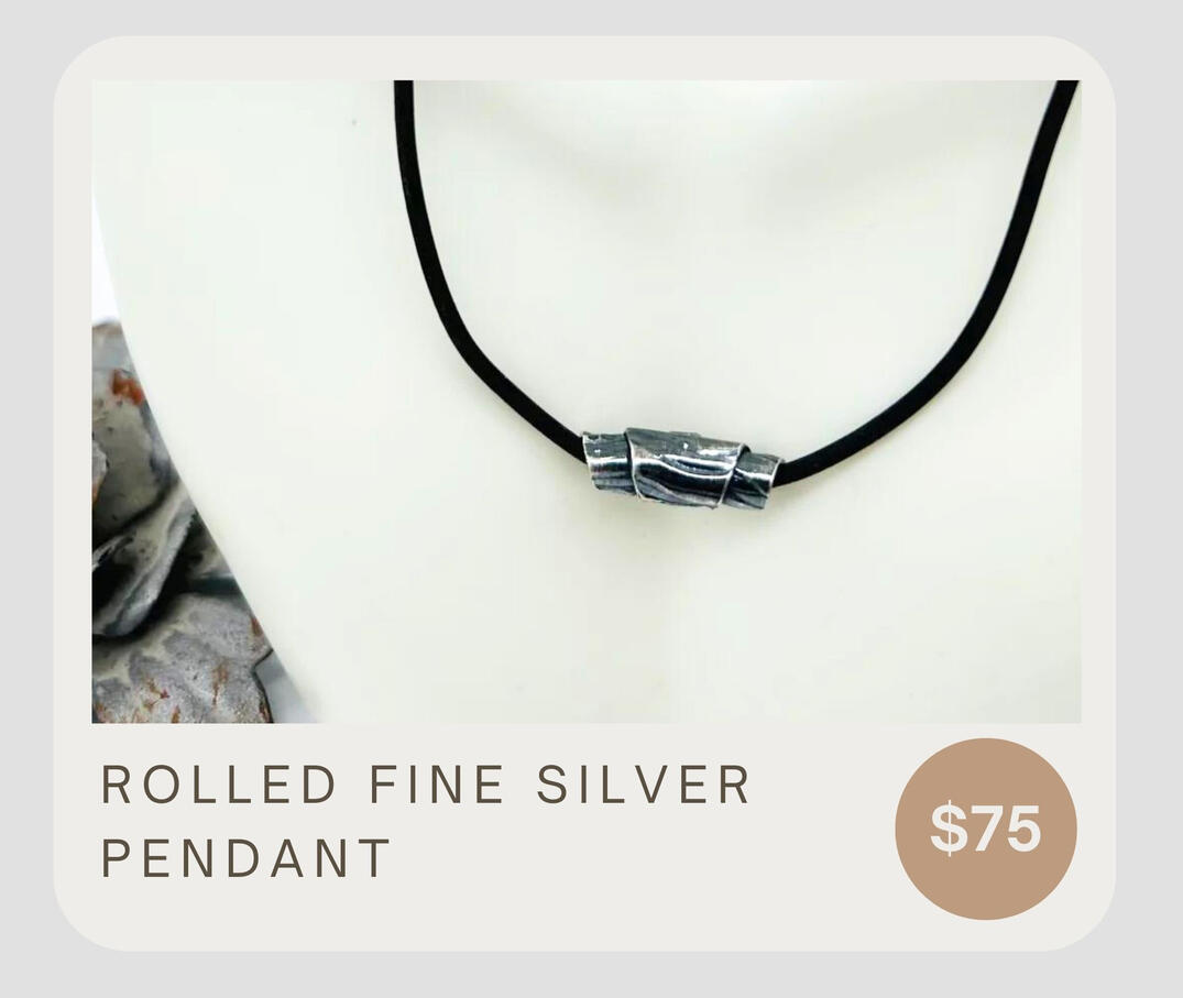 A fine silver rolled pendant with a textured look, rubber necklace, and sterling silver connectors.